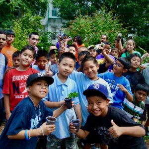 kids holding plants