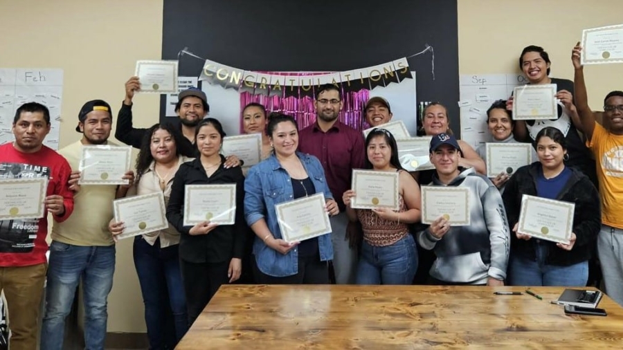 One of our ESOL classes during their graduation celebration this June!