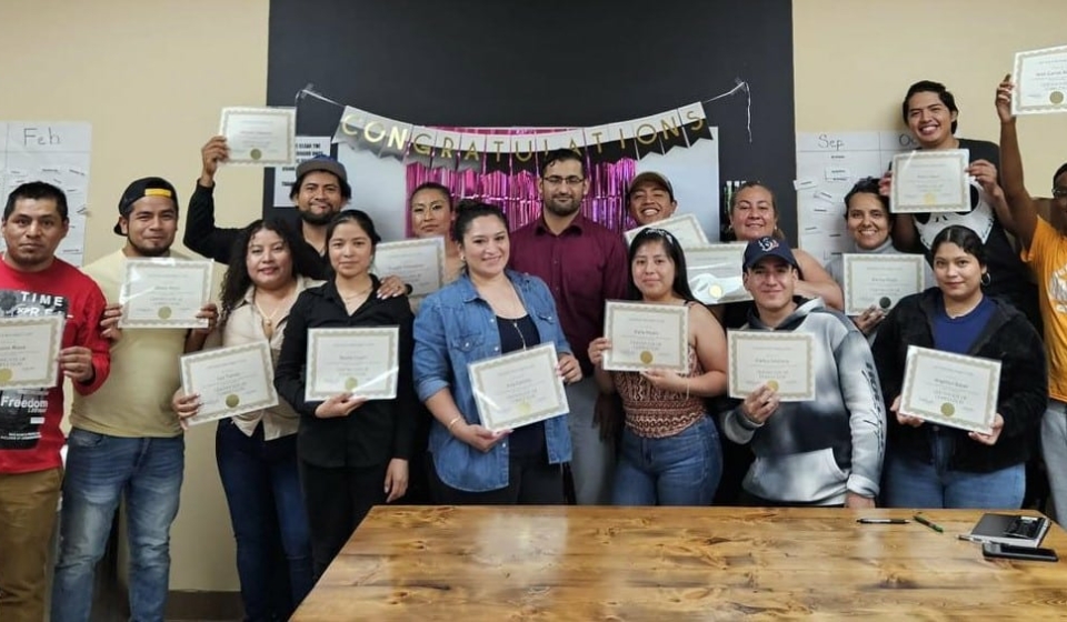 One of our ESOL classes during their graduation celebration this June!