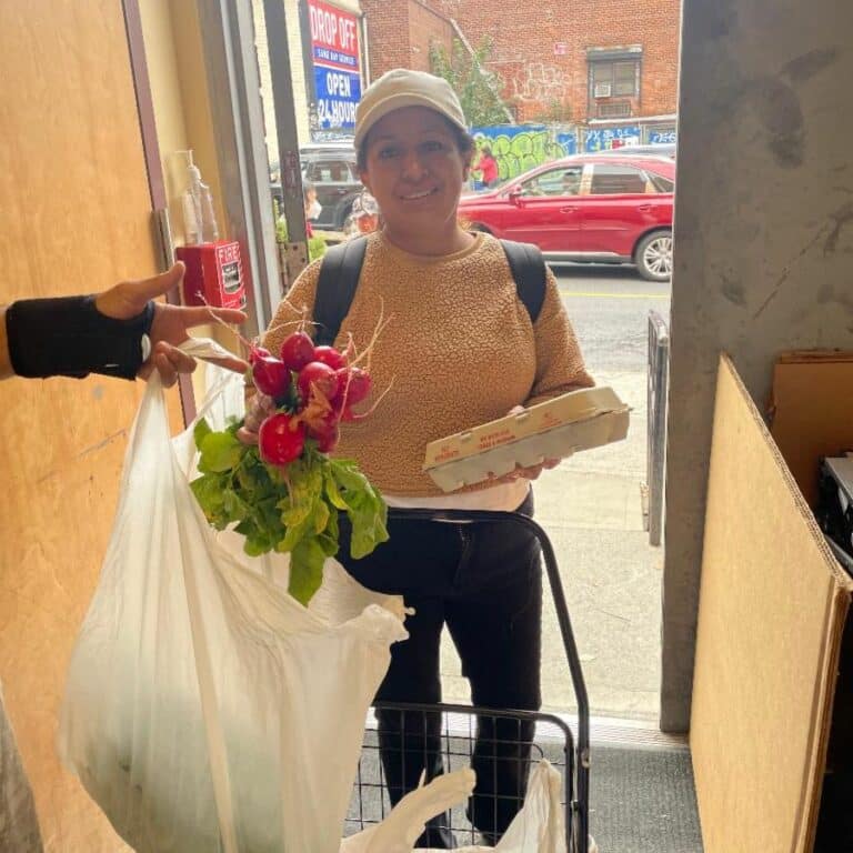 CFL food pantry clients picking up their produce and eggs