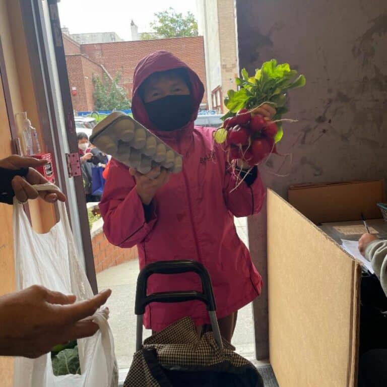 CFL food pantry clients picking up their produce and eggs