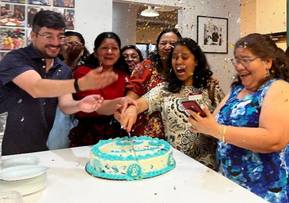 Coop members cutting the cake during the celebration of the Brightly launch